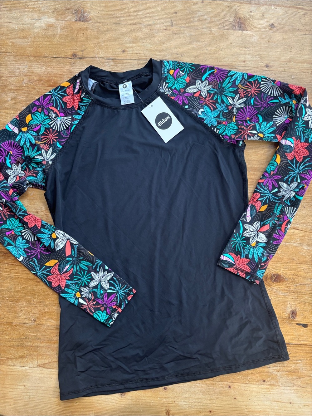 Eidon Surf | Black Rash Guard with Multicolor Floral Sleeves